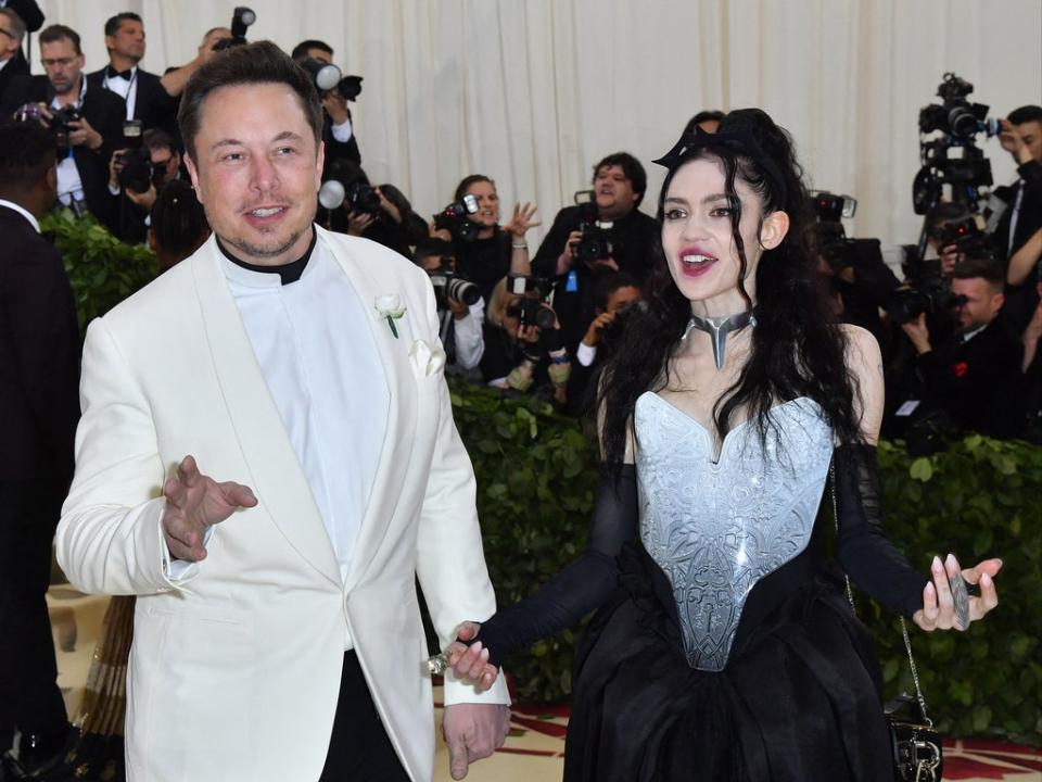 Elon Musk and former partner Grimes arrive for the 2018 Met Gala (AFP via Getty Images)