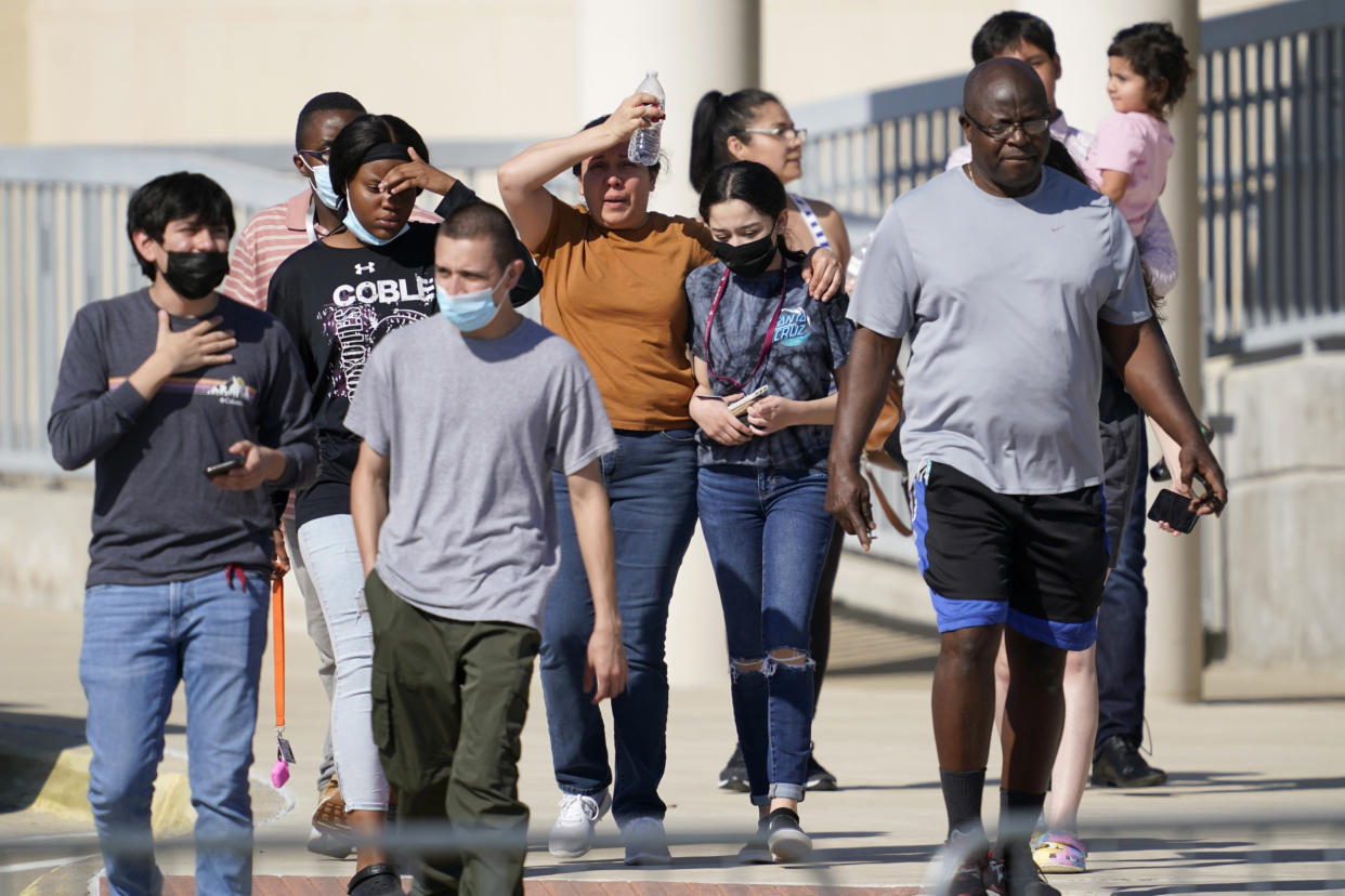 Parents are reunited with their children following the Oct. 6 shooting at Timberview High School.  (Tony Gutierrez / AP file)