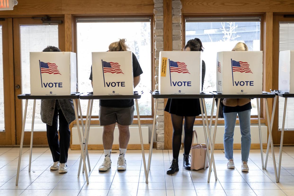 Voters cast their ballots in Madison, Wisc., on Nov. 8, 2022, as numerous close races draw to a close. <a href="https://media.gettyimages.com/id/1244617941/photo/americans-head-to-the-polls-to-vote-in-the-2022-midterm-elections.jpg?s=612x612&w=gi&k=20&c=YFoUUMeo-Di_QJQT8NphUY-5-HICYkN-w0BBqNT7F00=" rel="nofollow noopener" target="_blank" data-ylk="slk:Jim Vondruska/Getty Images;elm:context_link;itc:0;sec:content-canvas" class="link ">Jim Vondruska/Getty Images </a>