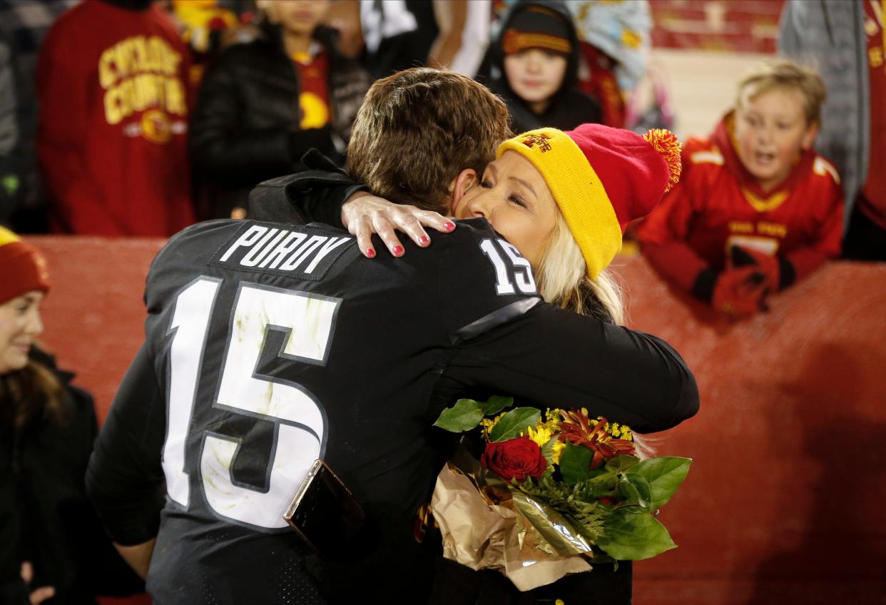 Iowa State quarterback Brock Purdy hugs his mom, Carrie Purdy, after leading the Cyclones to a 48-14 win over TCU on Nov. 26, 2021, at Jack Trice Stadium in Ames.