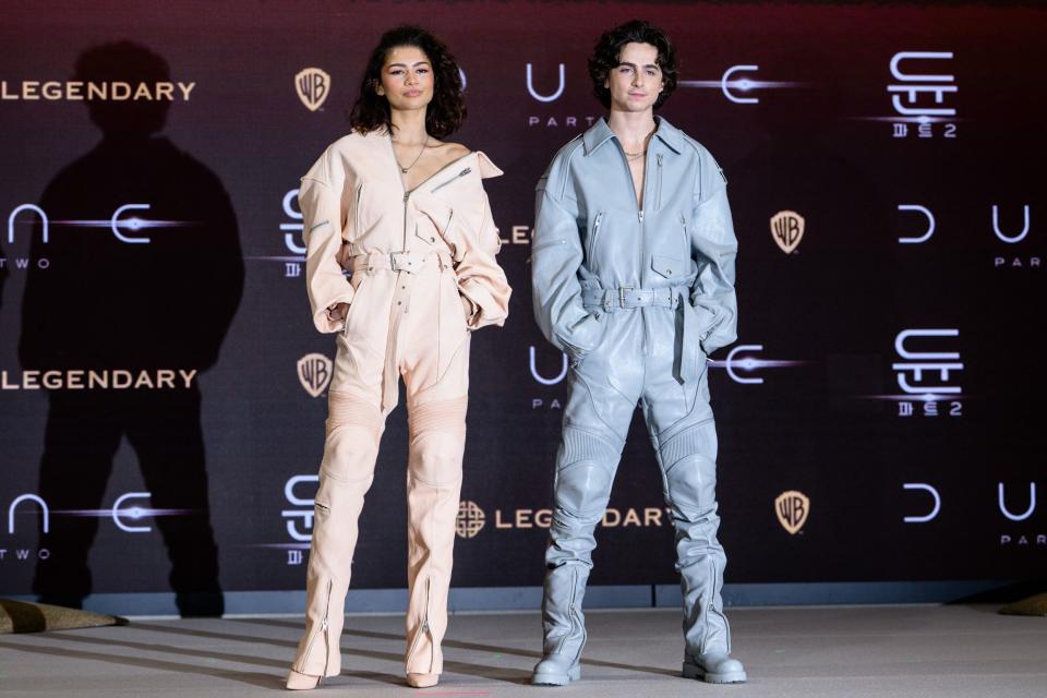 Zendaya and Timothée Chalamet in matching Juun J jumpsuits at the Dune: Part Two press conference in Seoul, South Korea