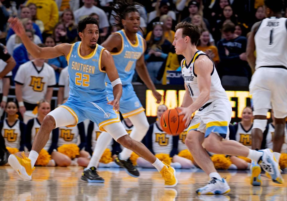 Marquette's Tyler Kolek, right, is part of one of the elite offenses in college basketball this season.
