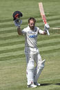 New Zealand's Kane Williamson celebrates his double century during play on day two of the first cricket test between the West Indies and New Zealand in Hamilton, New Zealand, Friday, Dec. 4, 2020. (Andrew Cornaga/Photosport via AP)