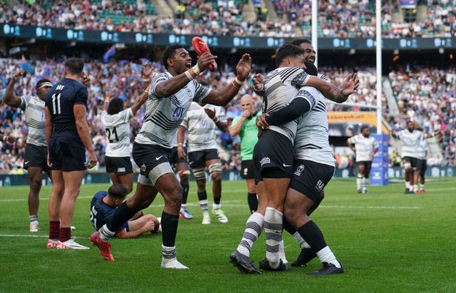 Fiji players celebrate the final whistle after their win over England at Twickenham in August