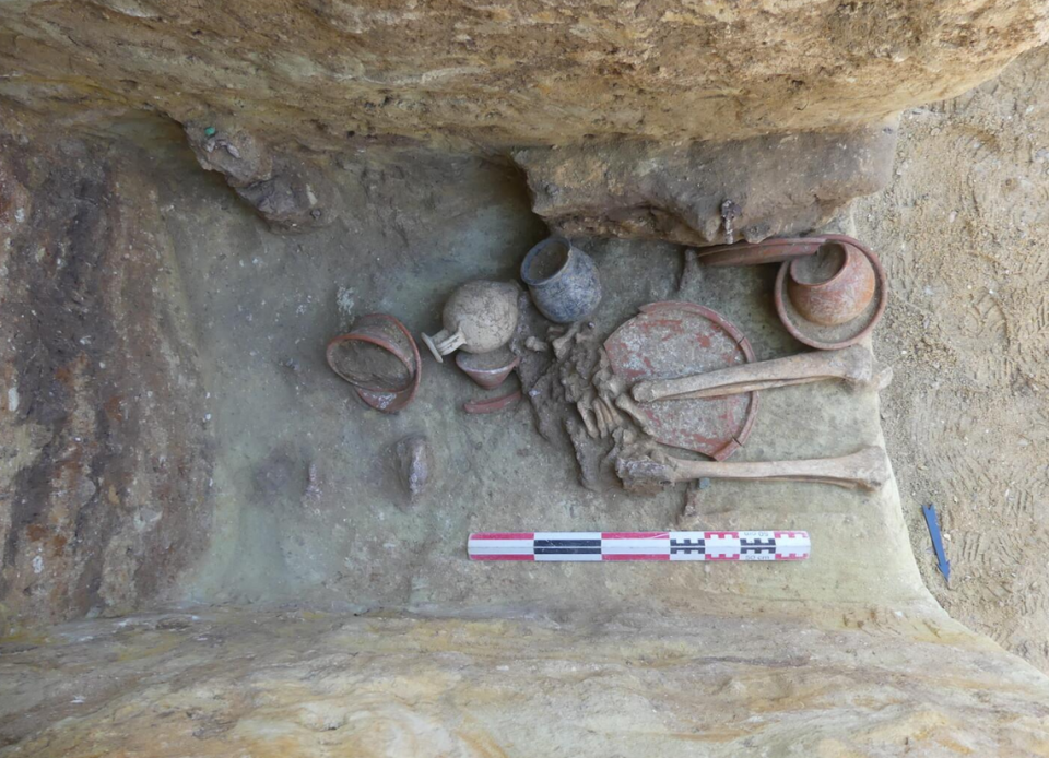 One of the graves containing eight ceramic vessels