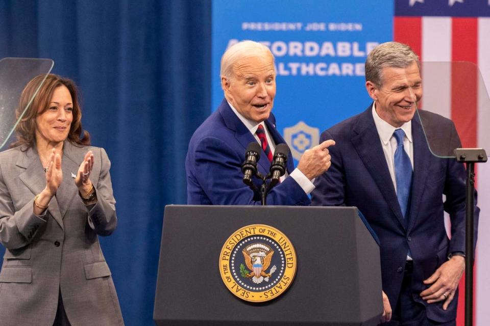 Vice President Kamala Harris, President Joe Biden and Gov. Roy Cooper join each other on stage after speeches on heath care during a campaign stop at the Chavis Community Center in Raleigh on Tuesday, March 26, 2024.
