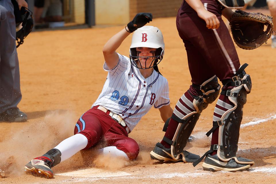 Ballard’s Emory Donaldson scores against Henderson County in the Kentucky State Softball Championship.June 10, 2023