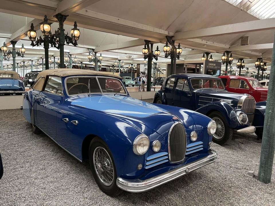 a blue car in a showroom