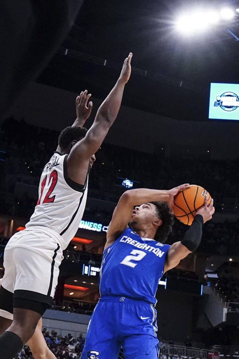 Creighton guard Ryan Nembhard (2) shoots against San Diego State guard Darrion Trammell (12) in the second half of a Elite 8 college basketball game in the South Regional of the NCAA Tournament, Sunday, March 26, 2023, in Louisville, Ky. (AP Photo/John Bazemore)