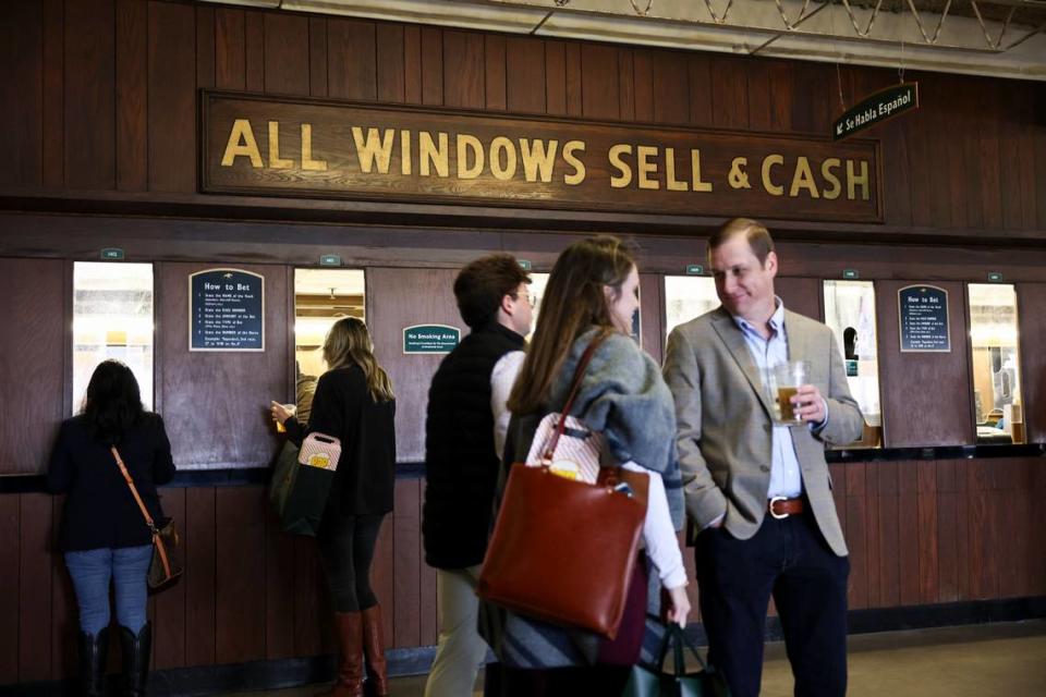 Patrons place bets during opening day of 2024 Spring Meet at Keeneland.