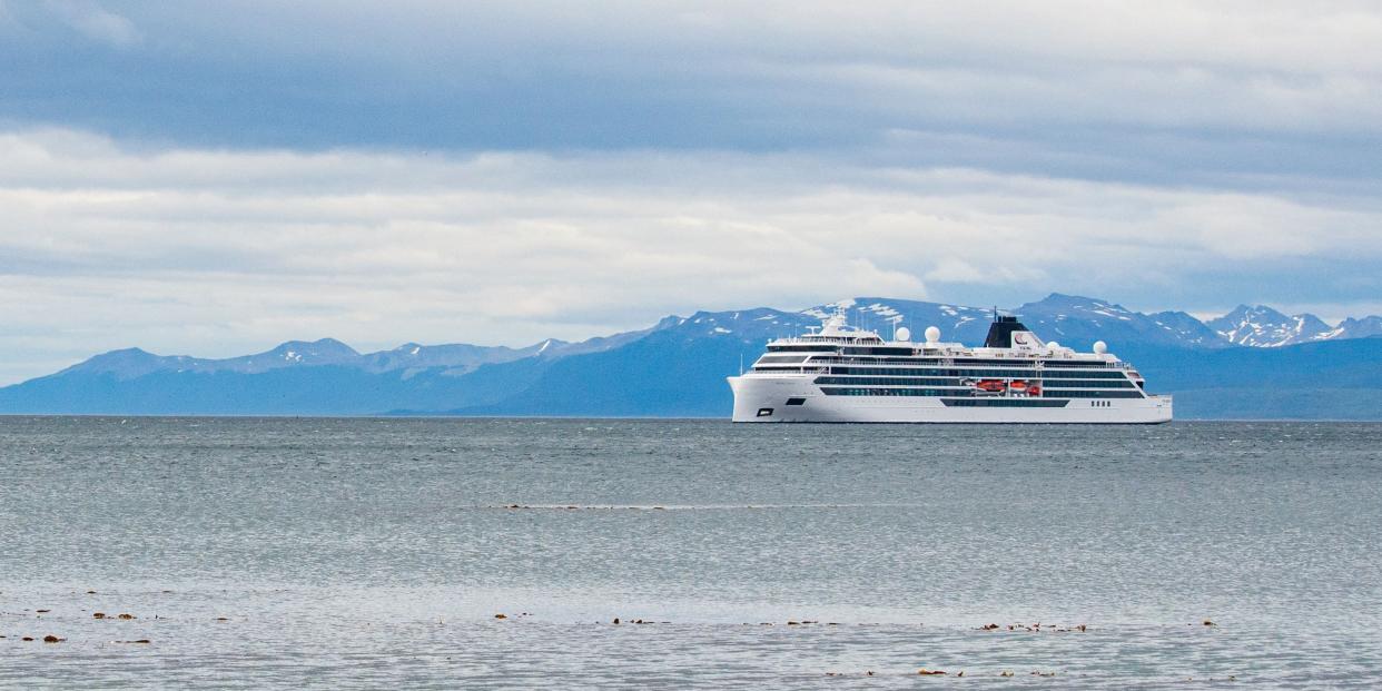 The Viking Polaris cruise ship sits on the water.