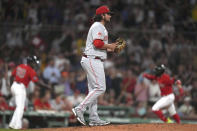 Cincinnati Reds' Gibaut, center, walks across the mound as Boston Red Sox's Enrique Hernandez, right, runs the bases after hitting a home run during the seventh inning of a baseball game Thursday, June 1, 2023, in Boston. (AP Photo/Steven Senne)