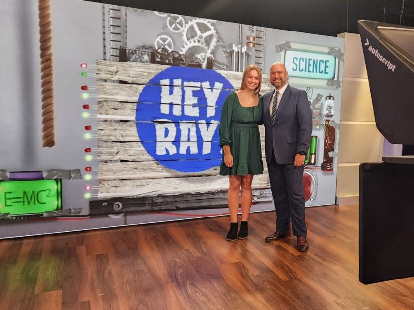 Petelin with his daughter on a TV set.