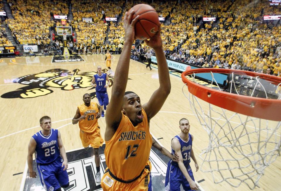 Wichita State's Darius Carter dunks against Drake during the second half of an NCAA basketball game, Saturday, Feb. 22, 2014 in Wichita, Kan. (AP Photo/The Wichita Eagle, Travis Heying) LOCAL TV OUT; MAGS OUT; LOCAL RADIO OUT; LOCAL INTERNET OUT