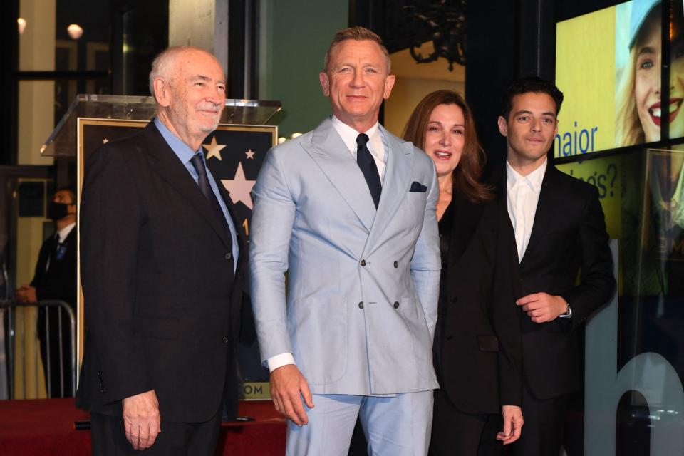 British actor Daniel Craig (2nd L) poses with (from L) US screenwriter Michael G. Wilson, US producer Barbara Broccoli and US actor Rami Malek during the ceremony to honor him with a star on the Hollywood Walk of Fame in Los Angeles, California, on October 6, 2021. - Craig's star will be located at 7007 Hollywood Boulevard, chosen for Craig's portrayal of James Bond in '007' films. (Photo by VALERIE MACON / AFP) (Photo by VALERIE MACON/AFP via Getty Images)