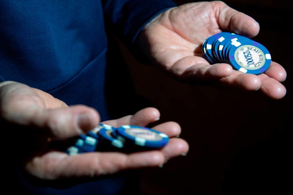 Jim McIngvale, better known as ‘Mattress Mack’, holds out $25,000 chips before making a $500,000 bet on the winner of the NCAA Men’s Basketball Tournament at the Beau Rivage Casino in Biloxi on Tuesday, Nov. 15, 2022.