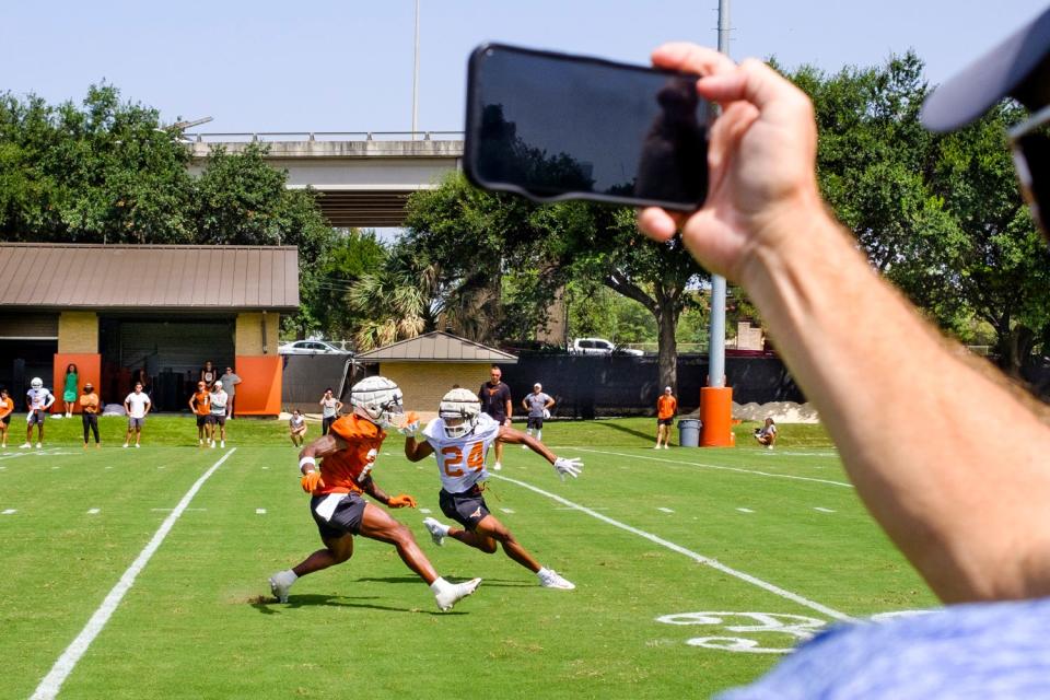 Texas wide receiver Mathew Golden and defensive back Warren Roberson, right, run a drill during the first fall football camp practice for the Texas Longhorns at Denius Fields on Wednesday July 31, 2024.