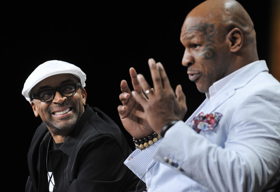 Spike Lee, left, director of "Mike Tyson: Undisputed Truth," listens as Tyson answers a question during HBO's Summer 2013 TCA panel at the Beverly Hilton Hotel on Thursday, July 25, 2013, in Beverly Hills, Calif. (Photo by Chris Pizzello/Invision/AP)