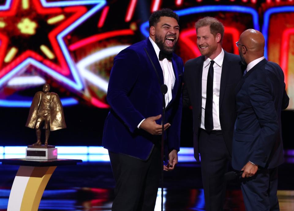 Cameron Heyward of the Pittsburgh Steelers, winner of the Walter Payton Man of the Year Award, Prince Harry, Duke of Sussex, and Keegan-Michael Key at the 13th Annual NFL Honors on February 8, 2024 in Las Vegas, Nevada [Photo by Perry Knotts/Getty Images].