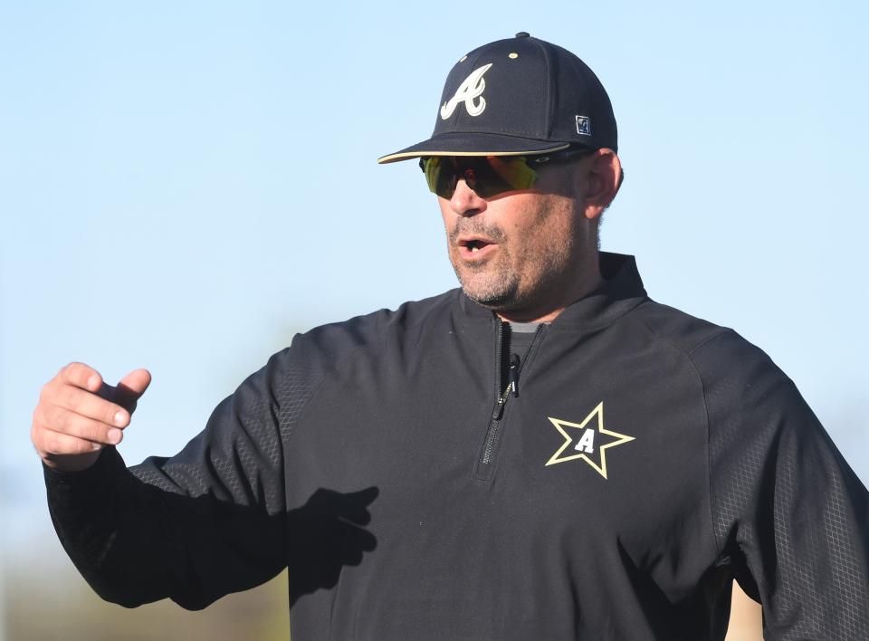 Abilene High coach Lee Fletcher turns to his dugout to get a pinch-runner in the sixth inning against Odessa High. The Eagles beat the Bronchos 5-3 in the District 2-6A game April 8 at Blackburn Field.