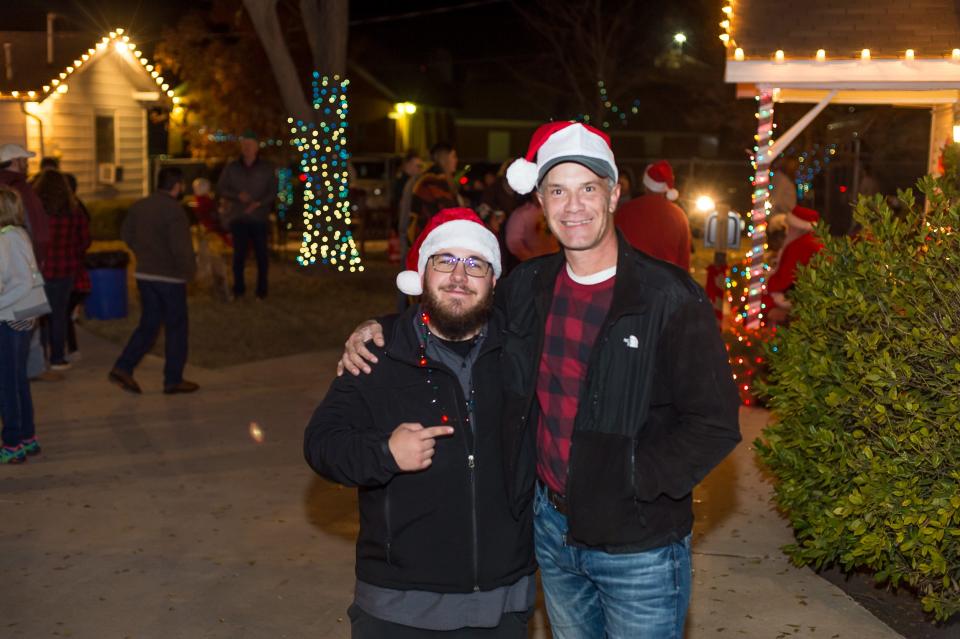 John Payne and Duncan Banks were out and about at the Home for Christmas hosted by Another Chance House, which included cookie decorating, a choir, storytelling and Santa and Mrs. Claus. along with food trucks around the properties.