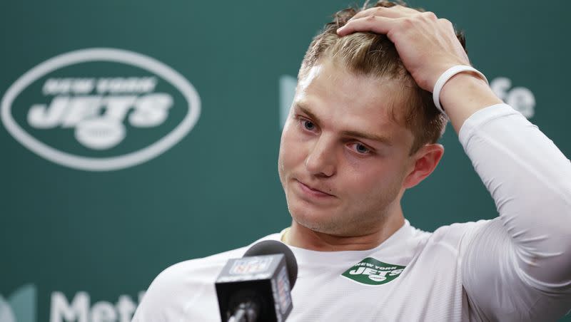 New York Jets quarterback Zach Wilson (2) answers questions during a news conference after an NFL football game against the New England Patriots, Sunday, Sept. 24, 2023, in East Rutherford, N.J. 