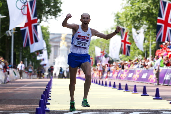 LONDON, ENGLAND - AUGUST 11: Sergey Kirdyapkin of Russia crosses the line to win gold during the Men's 50km Walk on Day 15 of the London 2012 Olympic Games on the streets of London on August 11, 2012 in London, England. (Photo by Streeter Lecka/Getty Images)