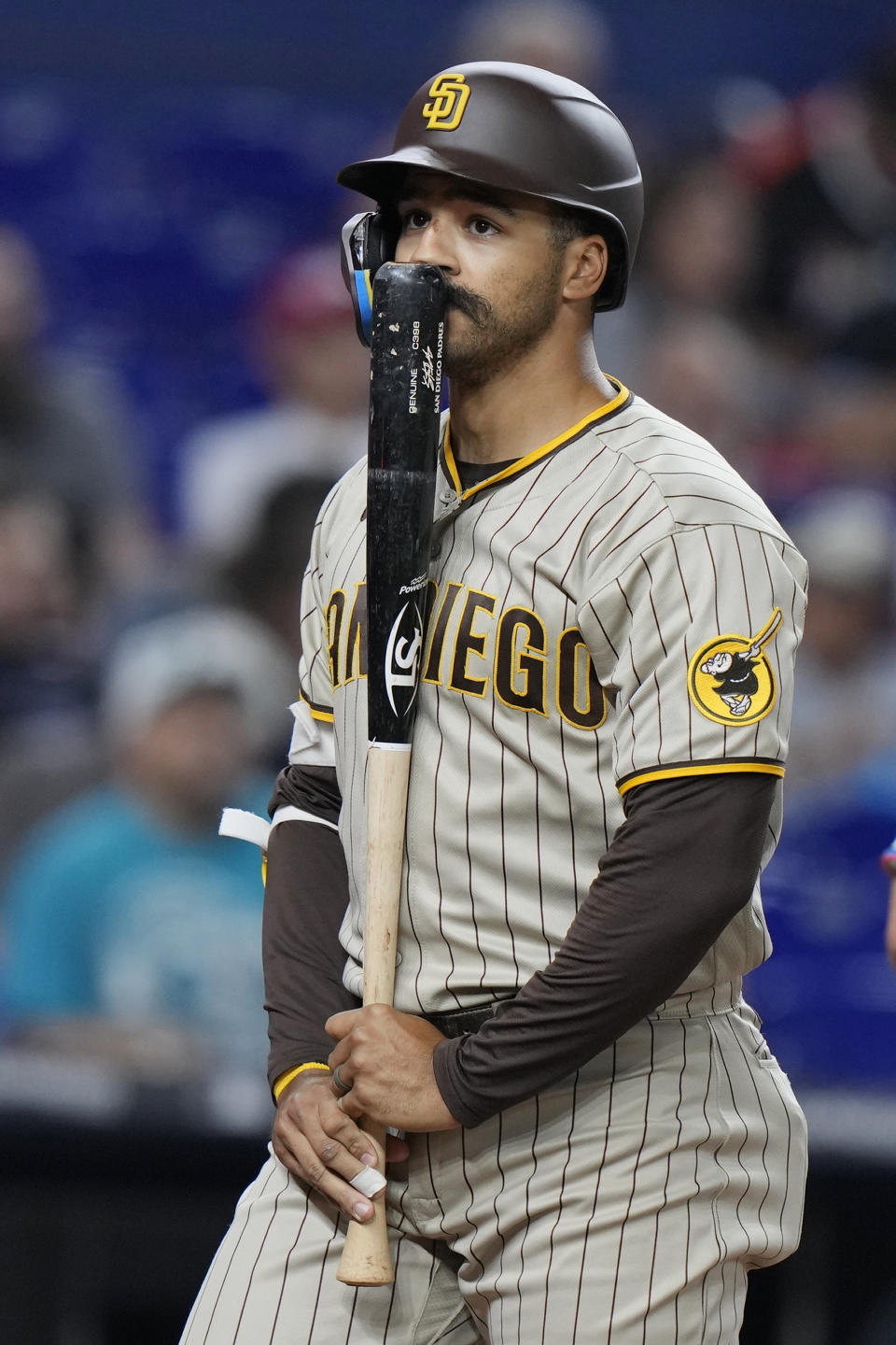 San Diego Padres' Trent Grisham reacts after striking out swinging during the ninth inning of a baseball game against the Miami Marlins, Wednesday, May 31, 2023, in Miami. (AP Photo/Wilfredo Lee)