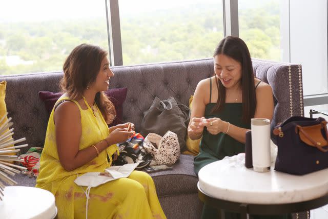 <p>Courtesy of Avni Shah/ InStyle</p> Avni and a close friend getting ready for a friend’s pre-wedding ceremony in DC. The modern salwar kameez was the first she purchased on her own.