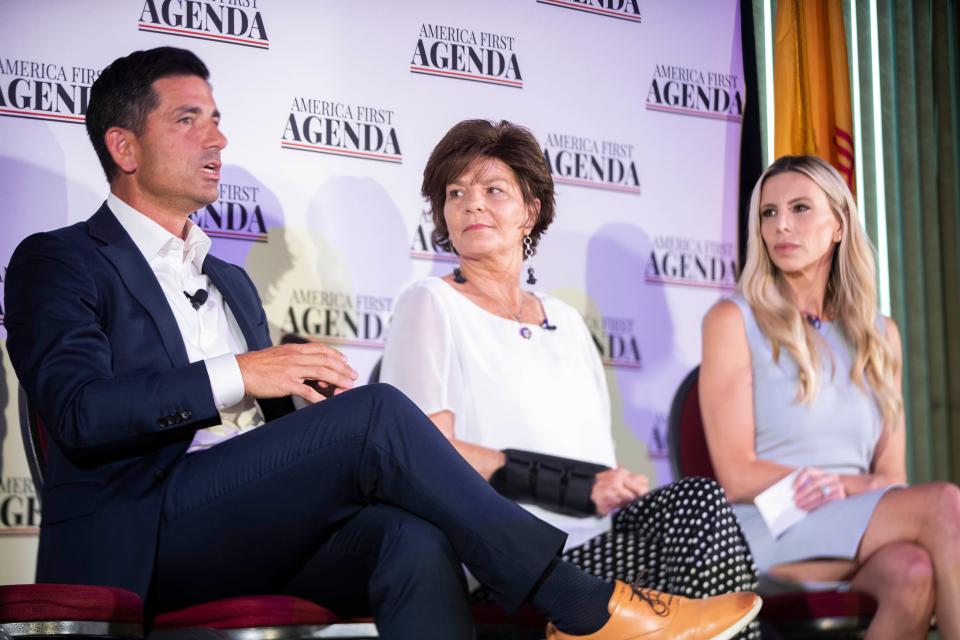 U.S. Rep. Yvette Herrell, R-N.M., middle, listens to Chad Wolf, AFPI executive director, speak during the America First Agenda Townhall hosted by America First Policy Institute Wednesday, Aug. 24, 2022, at New Mexico Farm and Ranch Heritage Museum.