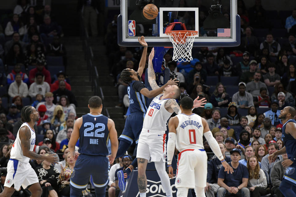 Memphis Grizzlies forward Ziaire Williams (8) shoots against Los Angeles Clippers center Daniel Theis (10) during the first half of an NBA basketball game Friday, Jan. 12, 2024, in Memphis, Tenn. (AP Photo/Brandon Dill)