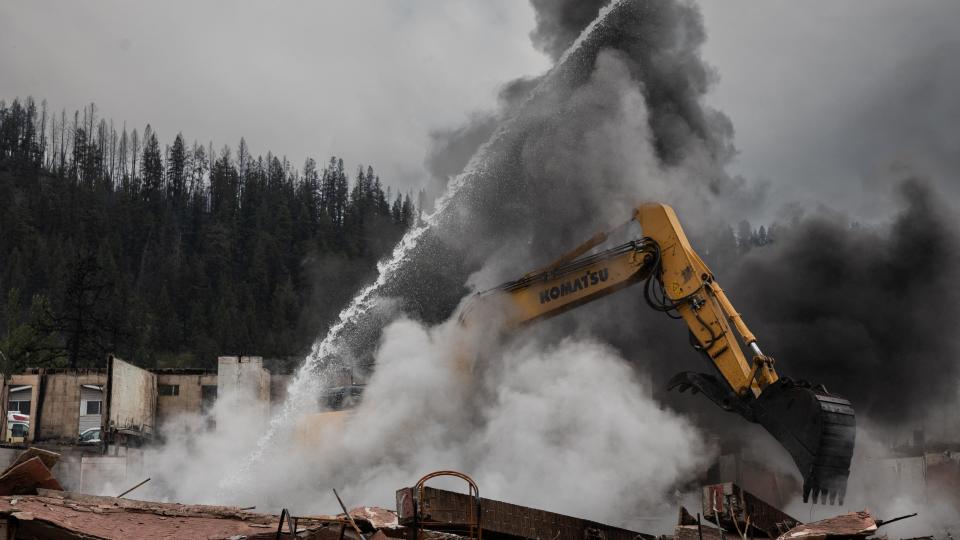 Fire crews work to cool down hotspots at Maligne Lodge, Jasper