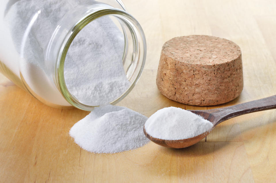 baking soda on a spoon and in a glass jar to clean baseball cap