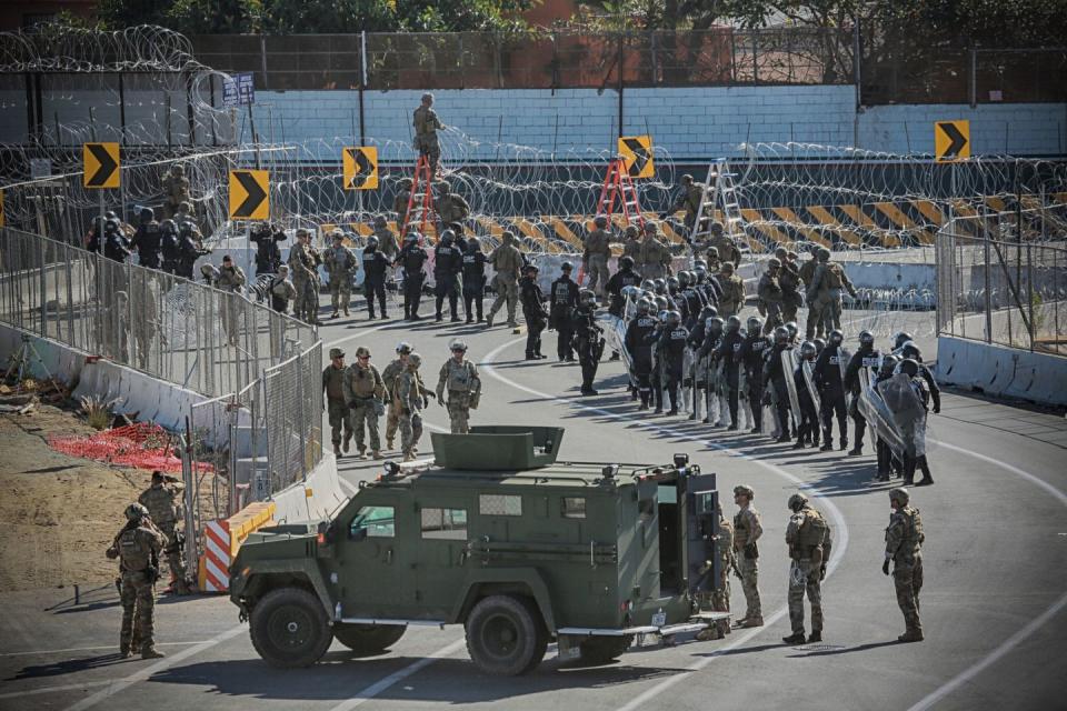 <p>United States Military personel and Border Patrol agents secure the United States-Mexico border on November 25, 2018 at the San Ysidro border crossing point south of San Diego, California.</p>