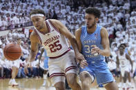 CORRECTS CITY TO BLOOMINGTON, INSTEAD OF INDIANAPOLIS - Indiana forward Race Thompson (25) and North Carolina forward Pete Nance (32) chase a loose ball during the first half of an NCAA college basketball game in Bloomington, Ind., Wednesday, Nov. 30, 2022. (AP Photo/Darron Cummings)