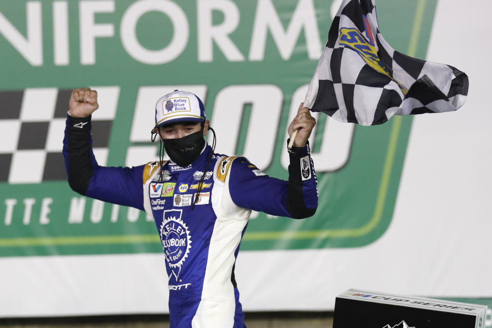 Chase Elliott celebrates after winning a NASCAR Cup Series auto race at Charlotte Motor Speedway Thursday, May 28, 2020, in Concord, N.C. (AP Photo/Gerry Broome)