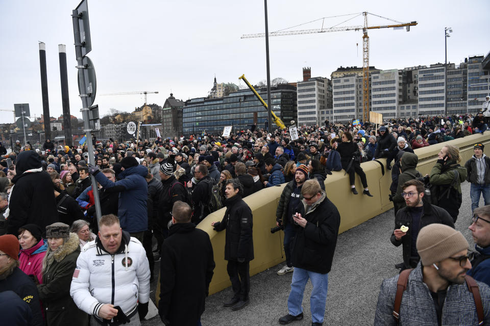 Anti-lockdown protesters demonstrate against coronavirus restrictions in Stockholm Saturday March 6, 2021. The protest was disbanded by police due to lack of permit for the public gathering. (Henrik Montgomery / TT via AP)