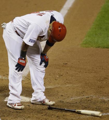 Yadier Molina hunches over after hitting into a double play during the sixth inning. (AP)