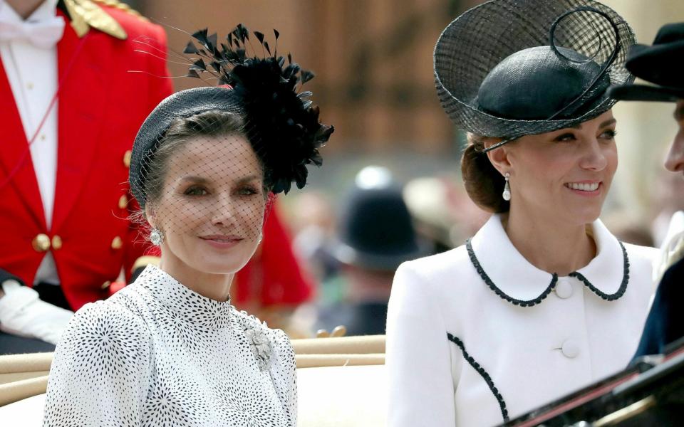 Queen Letizia wore an elaborate hatband when she met the Duchess of Cambridge in June 2019 - AP