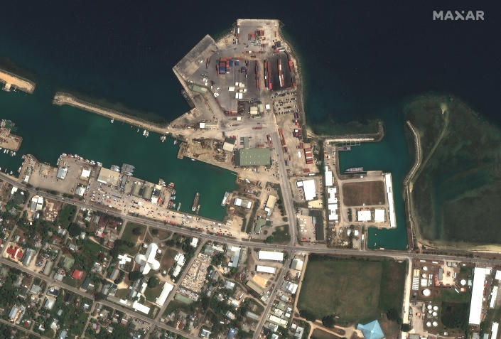 This satellite image provided by Maxar Technologies shows the main port facilities in Nuku’alofa, Tonga on Dec. 29, 2021. (Satellite image ©2022 Maxar Technologies via AP)