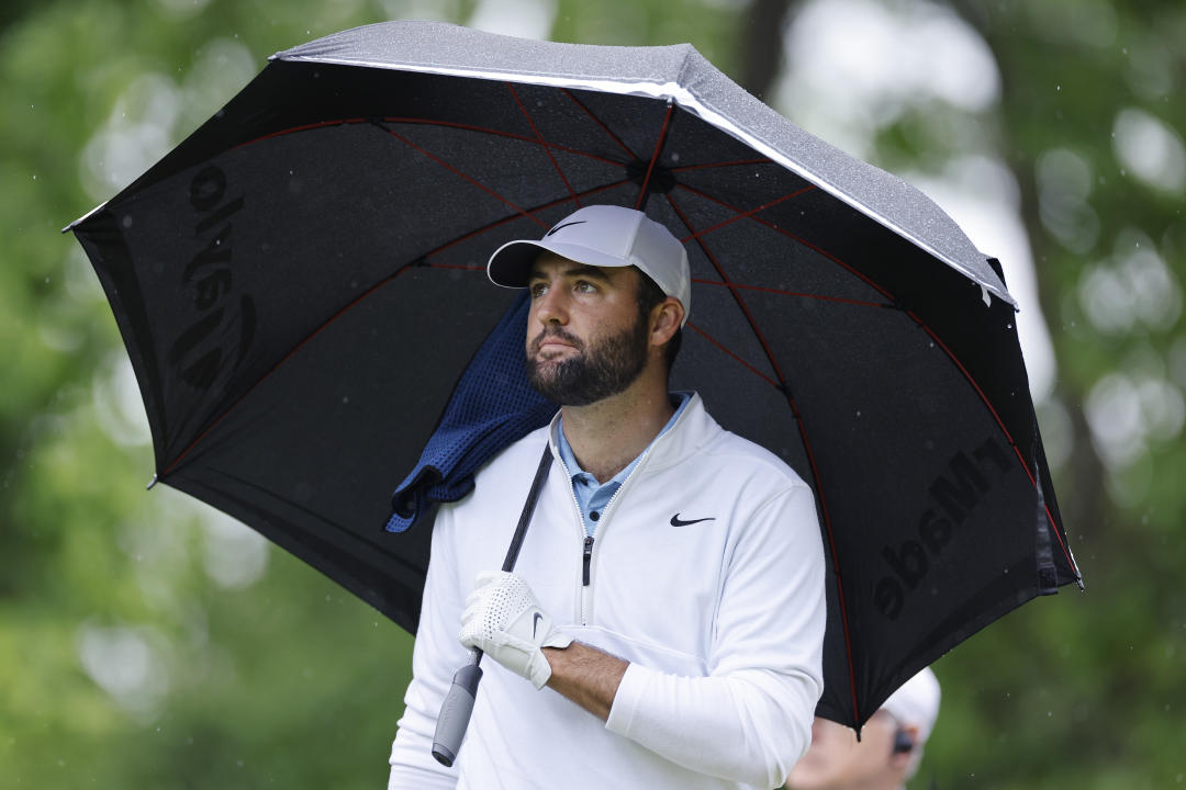 LOUISVILLE, KY - MAY 17: Scottie Scheffler (USA) holds an umbrella as he waits on the second hole during the second round of the 2024 PGA Championship at Valhalla Golf Club on May 17, 2024 in Louisville, Kentucky.  (Photo by Joe Robbins/Ikon Sportswire via Getty Images)