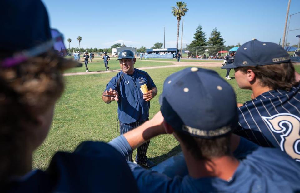 Central Catholic coach Danny Ayala talks to his players on the bench during the Northern California Regional Division III championship game with Oakmont at Central Catholic High School in Modesto, Calif., Saturday, June 3, 2023.