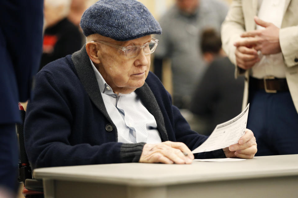 Former U.S. Sen. Harry Reid fills out his ballot at an early voting site at the East Las Vegas library, Saturday, Feb. 15, 2020, in Las Vegas. (AP Photo/John Locher)