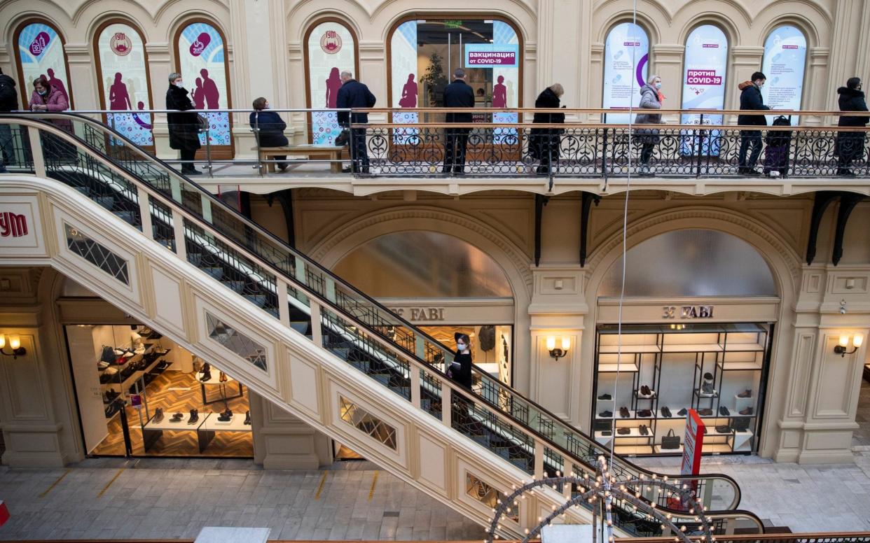 Muscovites can now get a shot of Russia's Sputnik-V vaccine at the Russian capital's best-known shopping arcade by Red Square - Pavel Golovkin/AP