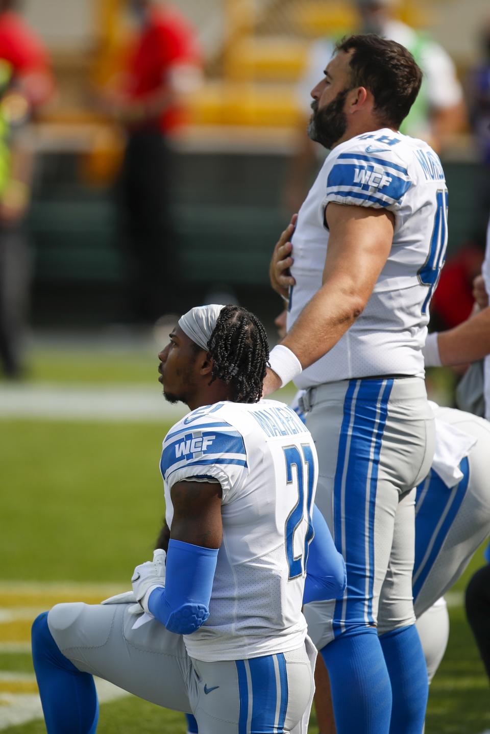 Detroit Lions' Tracy Walker takes a knee durng the national anthem before an NFL football game against the Green Bay Packers Sunday, Sept. 20, 2020, in Green Bay, Wis. (AP Photo/Matt Ludtke)
