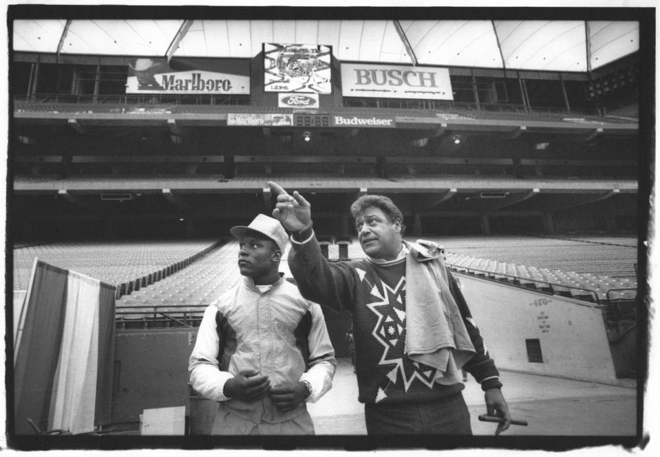 Lions first round draft pick Barry Sanders gets a tour from head coach Wayne Fontes of the Lions facilities at the Pontiac Silver Dome in 1989.