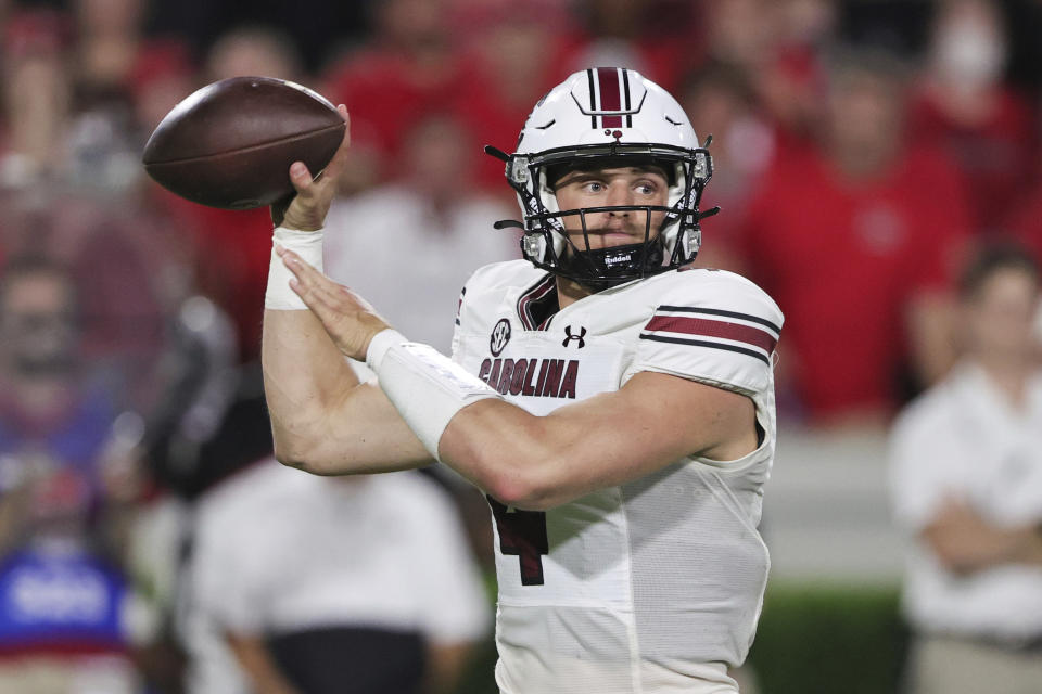 South Carolina quarterback Luke Doty (4) throws a pass against Georgia during the first half of an NCAA college football game Saturday, Sept. 18, 2021, in Athens, Ga. (AP Photo/Butch Dill)