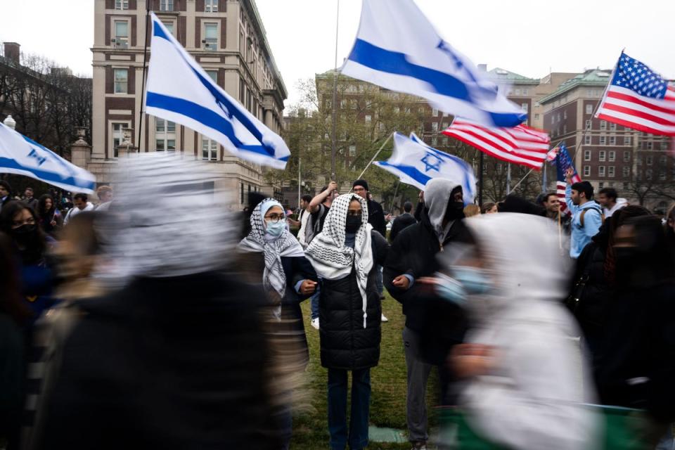 Students erect a line in front of pro-Israel students to protect a large pro-Palestine picket at Columbia University, on April 18, 2024.<span class="copyright">Nina Berman—Redux</span>