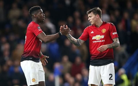 Manchester United's Paul Pogba celebrates scoring his side's second goal of the game with team-mate Victor Lindelof during the FA Cup fifth round match at Stamford Bridge, London - Credit: PA&nbsp;