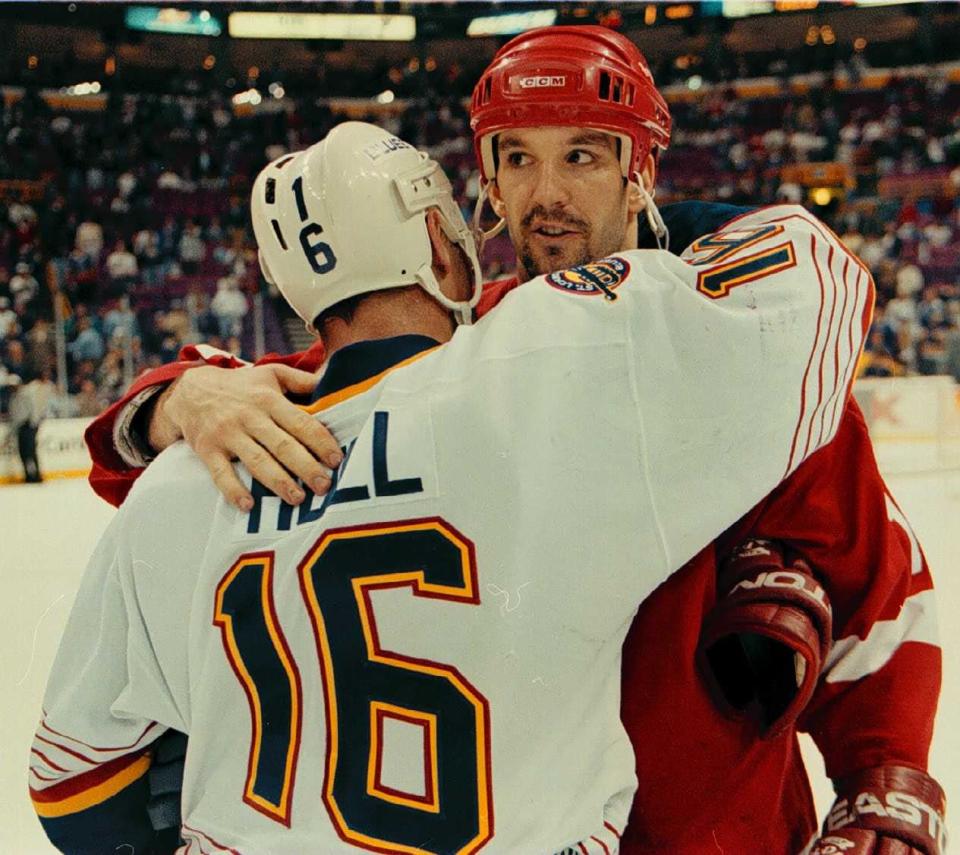 Red Wings forward Brendan Shanahan hugs Blues forward Brett Hull after Detroit beat the Blues to win the first round series on April 27, 1997, in St.  Louis.